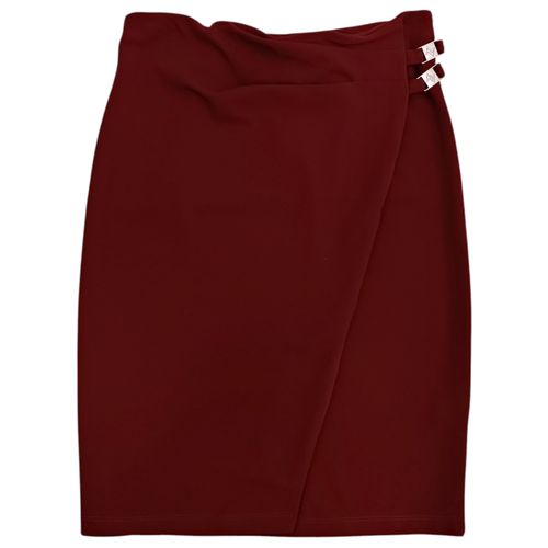Falda formal en color ocre recta con detalle de cruce para mujer
