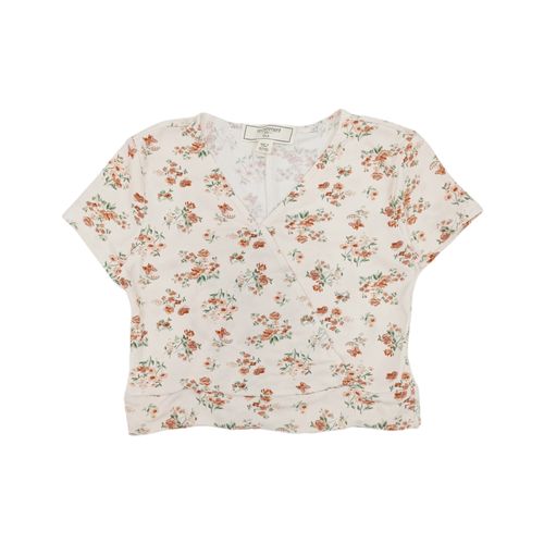 Blusa en color blanco con estampado y cuello V para niña