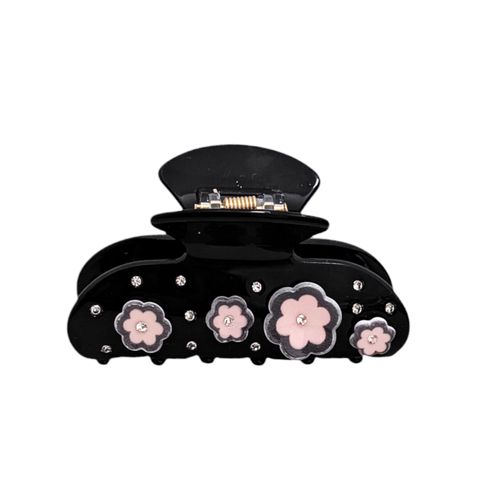 Gancho color negro con detalle floral para mujer