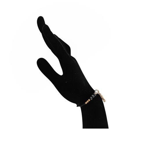 Pulsera color negro con dije religioso para mujer