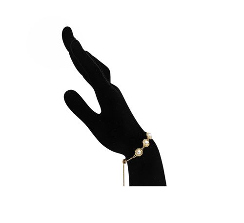 Pulsera color dorado con detalle de relieve circular para mujer