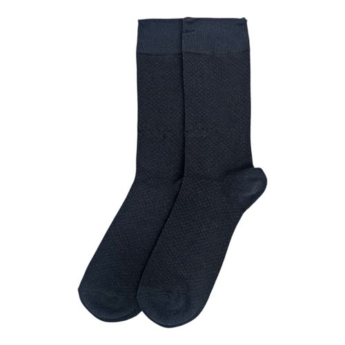 Un par de medias de vestir color azul oscuro para hombre